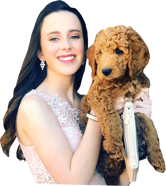 Woman Holding Goldendoodle Puppy